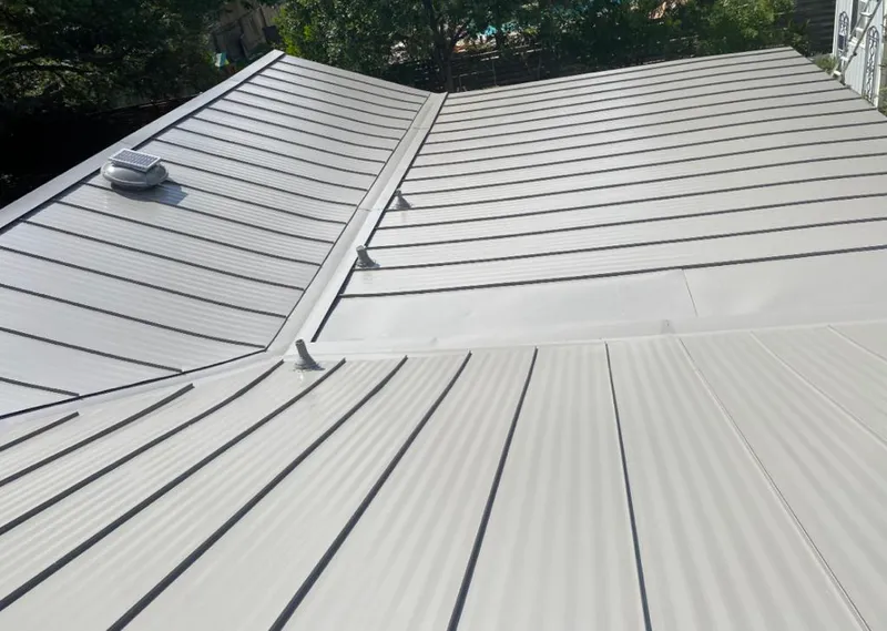 Solar attic fan installed on a metal roof for Roof Ventilation in Shiloh